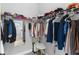 Organized walk-in closet with ample hanging space, shelving, and a full length mirror for easy outfit coordination at 14147 Campfire Ct, Parrish, FL 34219
