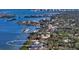 Panoramic aerial view of waterfront homes with boat docks along the scenic shoreline at 1440 Kimlira Ln, Sarasota, FL 34231