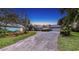 Charming home with separate guest house, spacious driveway and beautiful landscaping at 1440 Kimlira Ln, Sarasota, FL 34231