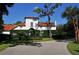 Exterior view of The Field Club with lush landscaping and manicured grounds at 1440 Kimlira Ln, Sarasota, FL 34231
