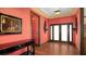 Elegant foyer with hardwood floors, ornate console table, and stylish wall decor at 1440 Kimlira Ln, Sarasota, FL 34231