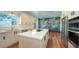 Bright kitchen with island cooktop, stainless appliances, and prep sink at 1440 Kimlira Ln, Sarasota, FL 34231