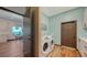 Convenient laundry room with modern appliances, adjacent to a dining area and views of the waterfront at 1440 Kimlira Ln, Sarasota, FL 34231