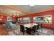 Open concept living and dining area with large windows showcasing water views at 1440 Kimlira Ln, Sarasota, FL 34231