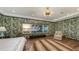 Elegant main bedroom featuring scenic water views and a decorative wallpaper at 1440 Kimlira Ln, Sarasota, FL 34231