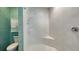 Modern shower stall featuring white geometric tiles, glass enclosure, and a built-in bench at 1440 Kimlira Ln, Sarasota, FL 34231