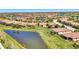Sprawling community with lush landscaping, serene lakes and red tiled roofs creates a beautiful scenic neighborhood at 167 Wandering Wetlands Cir, Bradenton, FL 34212