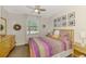 Cozy bedroom with wood floors and eclectic decor at 167 Wandering Wetlands Cir, Bradenton, FL 34212