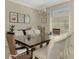 Dining room with natural light, modern light fixture, and contemporary artwork at 167 Wandering Wetlands Cir, Bradenton, FL 34212