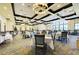 Elegant dining room with large windows, stylish lighting, and seating for a delightful dining experience at 167 Wandering Wetlands Cir, Bradenton, FL 34212