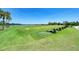 Well-manicured driving range with expansive green space, perfect for golf enthusiasts at 167 Wandering Wetlands Cir, Bradenton, FL 34212