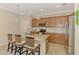 Well-equipped kitchen with stainless steel appliances, granite countertops, and a central island with seating at 167 Wandering Wetlands Cir, Bradenton, FL 34212