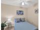Cozy bedroom featuring a comfortable bed, ceiling fan, and natural light, creating a relaxing atmosphere at 1679 Arlington St, Sarasota, FL 34239