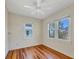 Bright bedroom with hardwood floors and multiple windows, offering ample natural light at 1679 Arlington St, Sarasota, FL 34239