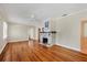 Spacious living room with hardwood floors and a decorative fireplace at 1679 Arlington St, Sarasota, FL 34239