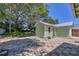 Outbuilding with colorful paver tiles, an awning, and natural wood door at 1679 Arlington St, Sarasota, FL 34239