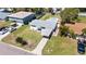Aerial view shows the house, with a carport and a well-maintained lawn at 1827 Nevada Ne Ave, St Petersburg, FL 33703