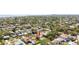 Lovely neighborhood shot showing the house location with a pool and mature trees at 1827 Nevada Ne Ave, St Petersburg, FL 33703