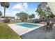 A well-maintained yard featuring an in-ground pool and privacy fence at 1827 Nevada Ne Ave, St Petersburg, FL 33703