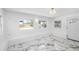 Bright bonus room featuring white marble-patterned flooring, neutral walls, and great natural light at 1827 Nevada Ne Ave, St Petersburg, FL 33703