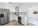 Modern kitchen featuring white cabinets, stainless steel appliances, and sleek countertops at 1827 Nevada Ne Ave, St Petersburg, FL 33703