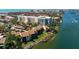 Aerial view showcasing waterfront condos, offering picturesque water views, and proximity to amenities at 1900 Cove Ii Pl # 133, Sarasota, FL 34242