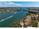 Breathtaking aerial view showcasing condos on the water with bridge, and boat traffic at 1900 Cove Ii Pl # 133, Sarasota, FL 34242