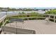 Community dock with benches, providing a serene spot to enjoy the waterfront scenery at 1900 Cove Ii Pl # 133, Sarasota, FL 34242