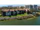Waterfront condos feature lush landscaping, direct water access, and scenic views of the intercoastal waterway at 1900 Cove Ii Pl # 133, Sarasota, FL 34242