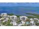 Aerial view of condo community with waterfront location and resort-style amenities, ideal for luxurious living at 1930 Harbourside Dr # 142, Longboat Key, FL 34228