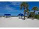 Beach pavilions with picnic tables offer shaded relaxation on the sandy shore at 1930 Harbourside Dr # 142, Longboat Key, FL 34228