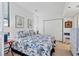 Comfortable bedroom featuring a closet and a window with natural light at 1930 Harbourside Dr # 142, Longboat Key, FL 34228