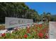 South Bay Isles community sign near a water feature and beautiful landscaping at 1930 Harbourside Dr # 142, Longboat Key, FL 34228