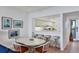 Bright dining area adjacent to the kitchen, featuring a breakfast bar with seating at 1930 Harbourside Dr # 142, Longboat Key, FL 34228