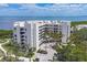 Stunning multi-story condo building with lush landscaping and waterfront views, offering luxurious coastal living at 1930 Harbourside Dr # 142, Longboat Key, FL 34228
