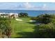 Scenic golf course view with lush greens and beautiful water views at 1930 Harbourside Dr # 142, Longboat Key, FL 34228