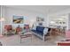 Cozy living room open to the dining area, creating a seamless flow for entertaining at 1930 Harbourside Dr # 142, Longboat Key, FL 34228