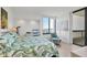 Relaxing main bedroom filled with natural light and offering beautiful water views at 1930 Harbourside Dr # 142, Longboat Key, FL 34228