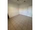 Cozy bedroom with tile flooring, a ceiling fan, and ample natural light at 2097 Wasatch Dr, Sarasota, FL 34235