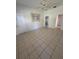 Bedroom with tile flooring, a ceiling fan, and two entryways for ease of access at 2097 Wasatch Dr, Sarasota, FL 34235