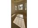 Bedroom with tile floors and a window letting in natural light at 2097 Wasatch Dr, Sarasota, FL 34235