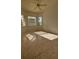 Well-lit bedroom with tile floors and three windows at 2097 Wasatch Dr, Sarasota, FL 34235