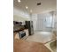 Well-equipped kitchen with modern stainless steel appliances, light cabinets, and tile flooring at 2097 Wasatch Dr, Sarasota, FL 34235