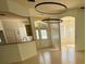 Bright and airy living area with tile floors and contemporary lighting, seamlessly connecting to other living spaces at 2097 Wasatch Dr, Sarasota, FL 34235