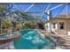 Inviting screened-in pool featuring a relaxing fountain and spacious deck area at 2301 Bern Creek Loop, Sarasota, FL 34240