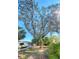 Spacious backyard featuring mature trees and lush greenery at 240 Pocono E Trl, Nokomis, FL 34275