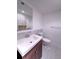 Clean bathroom with a modern vanity, toilet, and neutral color scheme creating a relaxing ambiance at 240 Pocono E Trl, Nokomis, FL 34275