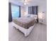 Cozy bedroom with a plush bed, window, and bedside tables with soft lighting at 240 Pocono E Trl, Nokomis, FL 34275