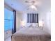 Inviting bedroom with a ceiling fan, window, and bedside tables with lamps at 240 Pocono E Trl, Nokomis, FL 34275