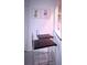 Charming breakfast bar with modern stools and cheerful artwork enhancing the cozy space at 240 Pocono E Trl, Nokomis, FL 34275